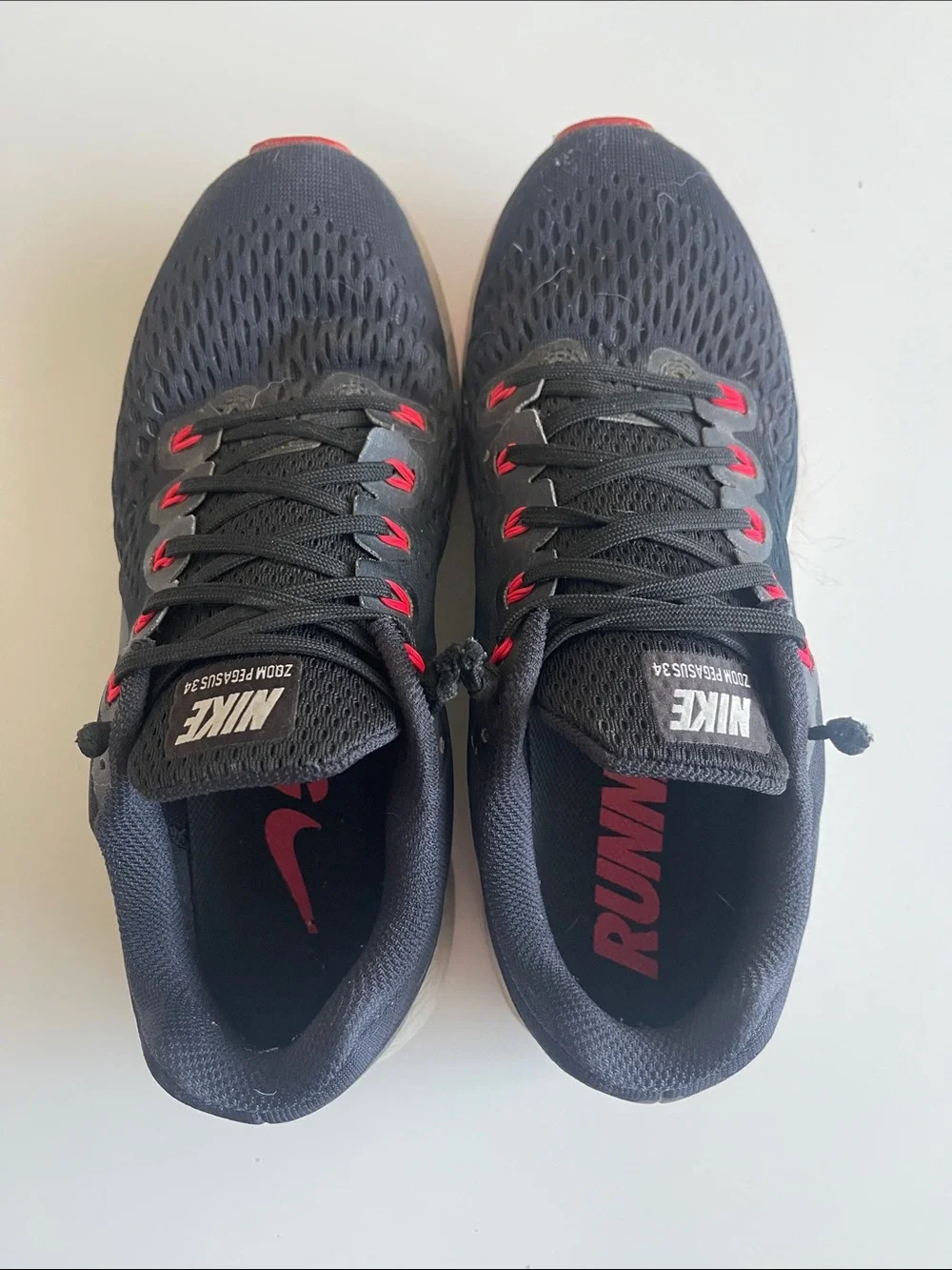 Nike Men’s Black Running Shoes with Pink-Red Accents